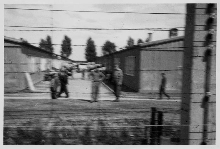 Photograph taken by Eisenstein of barracks at Dachau. When Eisenstein entered, he saw people lying down in the barracks on slabs of wood, with nothing to sleep on. He remembers that the people were in a daze and no one spoke to each other.