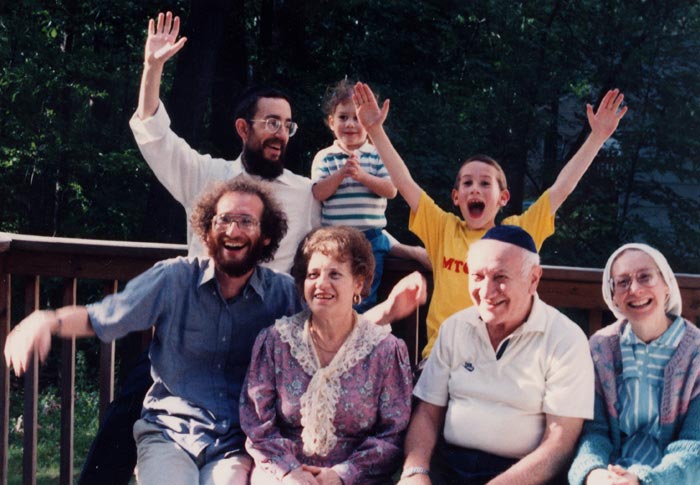 Karl and Ruth Diamond with their family during a Thanksgiving reunion in New York, circa 1991. Ruth's son Fredy is at her side and her daughter is sitting next to Karl. Her son in law David is waving in the back row next to the two grandchildren.