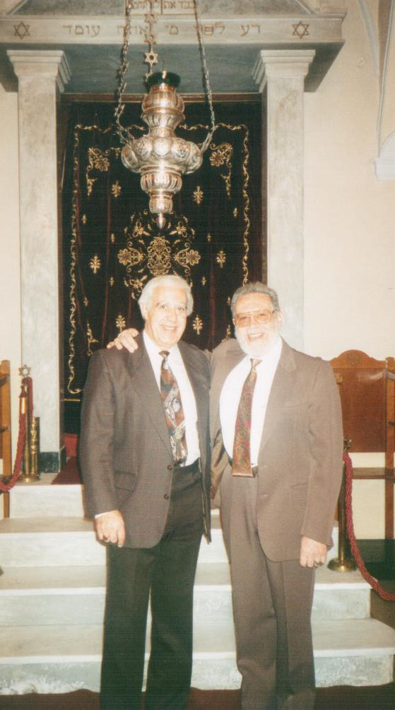 Jack Cohen returned many times to Greece, taking his family there to visit relatives. His father, Albert, refused to return to Greece, burdened by memory. Here Jack is with his late cousin, Rabbi Menasseh Cohen, who led a High Holiday service at the Chalkis Synagogue while visiting from Israel in 2000.
