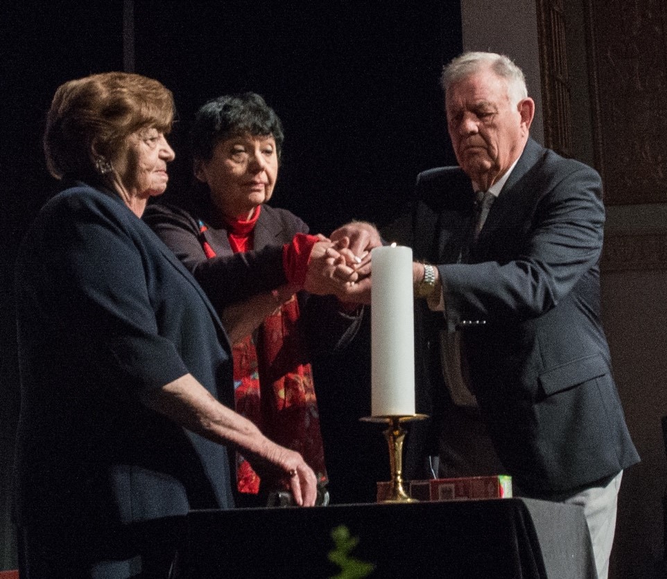 Theresienstadt Concentration Camp Czech Jewish Holocaust Survivor Ela Stein-Weissberger, German Jewish Holocaust Survivor Inge Auerbacher; and Dachau Concentration Camp Liberator Jimmy Gentry perform a candle lighting ceremony, during the 2013 Federal Inter-Agency Holocaust Remembrance Day, at the Lincoln Theater, on Wednesday, April 17, 2013, in Washington, D.C.