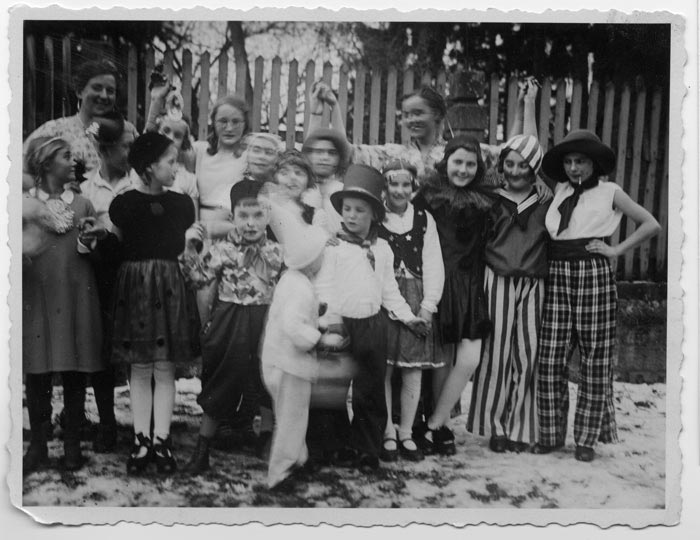 Hanna Hamburger, on the right wearing a striped sailor costume, with playmates and friends during a costume party in Eppingen, Germany.