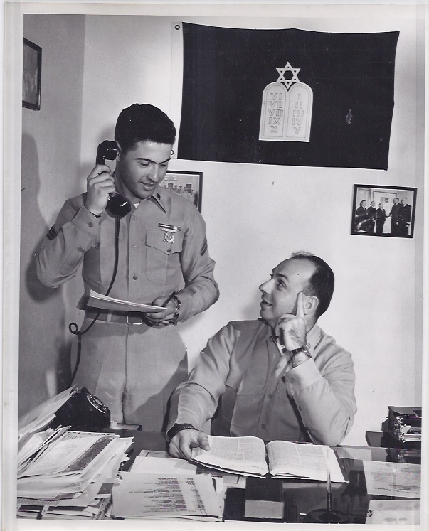 Marine Corps photo shows Manfred Judas, leftt, serving in his Jewish chaplain capacity.