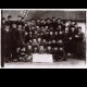 Max Notowitz with Jewish schoolmates at his Hebrew School in Kolbuszowa, Poland, before the war. Notowitz is pictured behind the banner, wearing a white collar.
