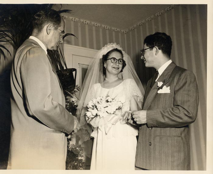 Eva Rosenfeld's wedding photograph from 1950 in Rochester, NY. Rabbi Goldstein is overseeing the ceremony. The Rosenfelds met in Rochester and now have four children and seven grandchildren.