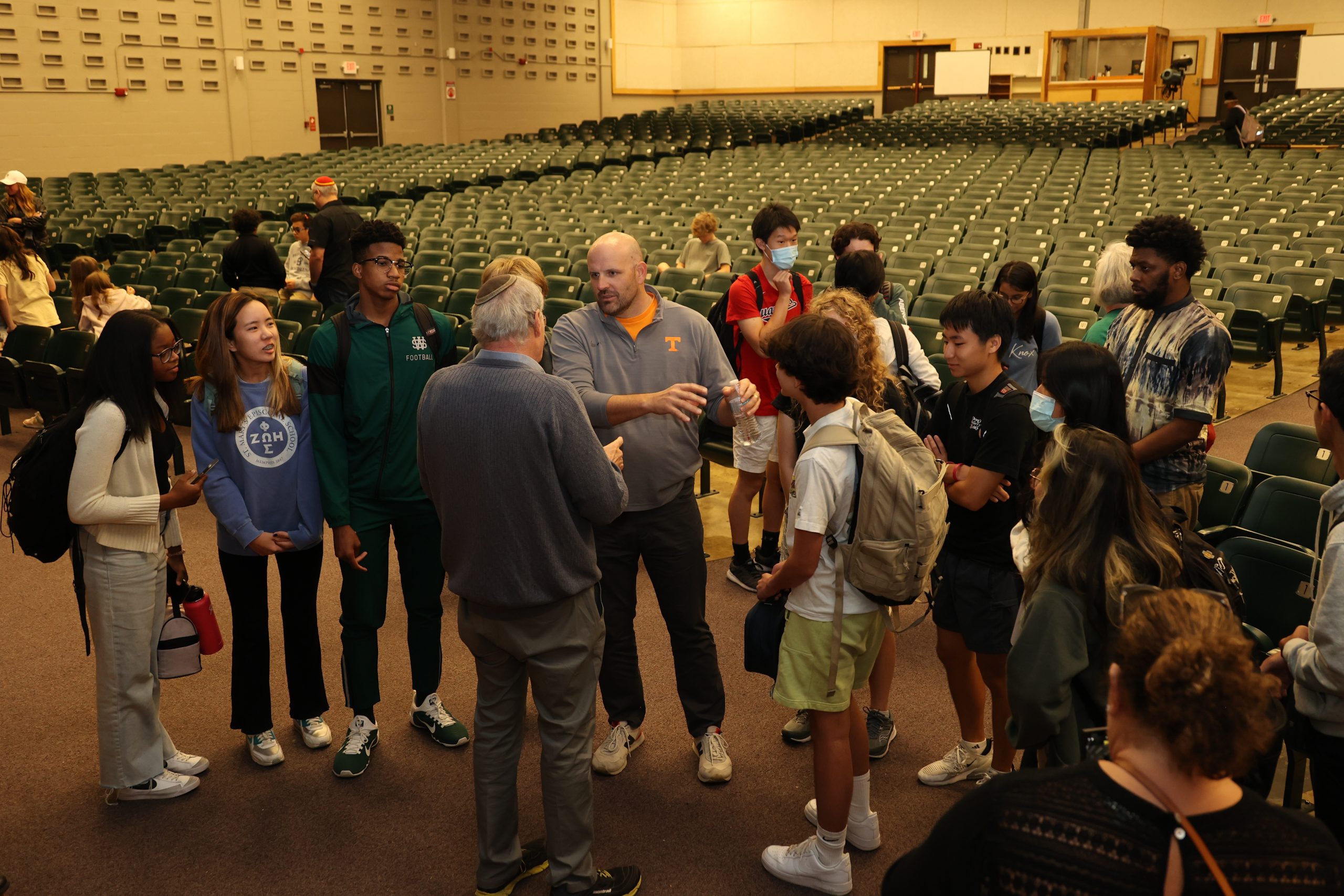 Dr. Efraim Zuroff speaking with educators and students after his presentation. 